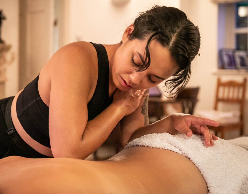 deep tissue massage masseuse using elbow to massage back body